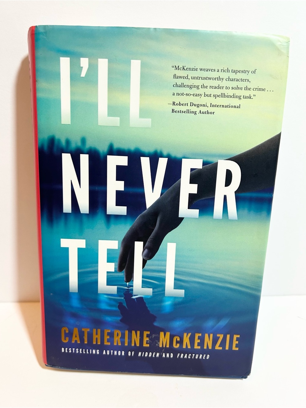 I’ll Never Tell by Catherine McKenzie Hardcover Book